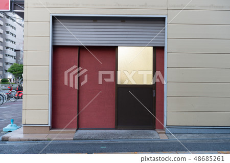 sidewalk by street wall & door sidewalk by street wall & door 48685261