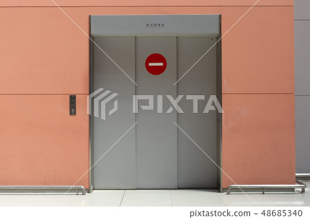 sidewalk by street wall & door sidewalk by street wall & door 48685340