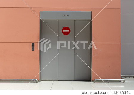 sidewalk by street wall & door sidewalk by street wall & door 48685342