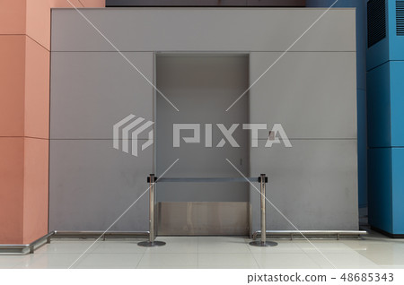 sidewalk by street wall & door sidewalk by street wall & door 48685343