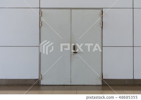 sidewalk by street wall & door sidewalk by street wall & door 48685355
