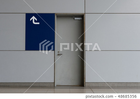 sidewalk by street wall & door sidewalk by street wall & door 48685356