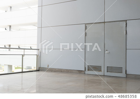 sidewalk by street wall & door sidewalk by street wall & door 48685358