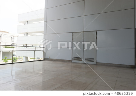sidewalk by street wall & door sidewalk by street wall & door 48685359
