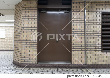 sidewalk by street wall & door sidewalk by street wall & door 48685366