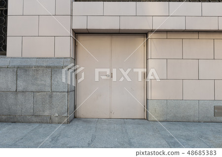 sidewalk by street wall & door sidewalk by street wall & door 48685383