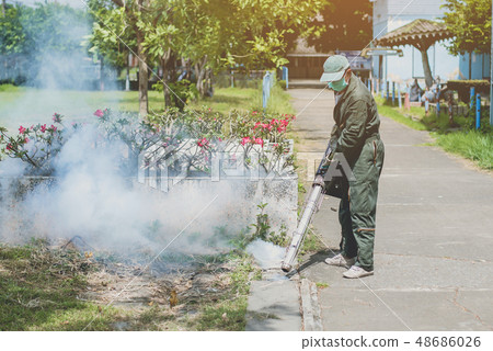 Man work fogging to eliminate mosquito Man work fogging to eliminate mosquito 48686026