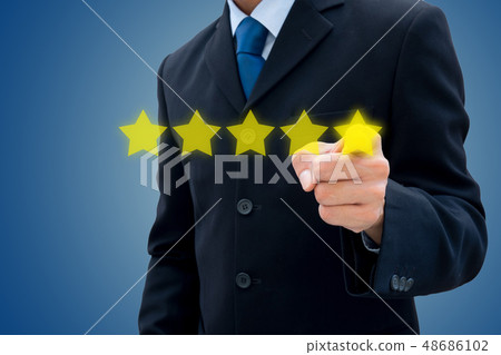 Businessman pushing on five stars for best rating. 48686102