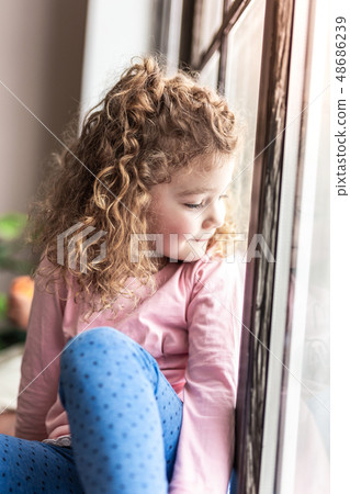 Portrait of cute little female that enjoying the moment Portrait of cute little female that enjoying the moment 48686239