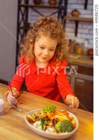 Charming blonde little female dreaming about dessert 48686720