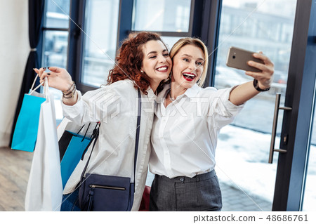 Blonde-haired mom making selfie with her lovely beautiful daughter 48686761