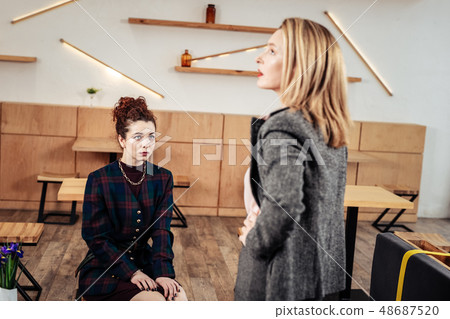 Businesswoman talking to her employee having personal meeting Businesswoman talking to her employee having personal meeting 48687520