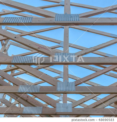 The horizontal beams of a wooden building square The horizontal beams of a wooden building square 48690583