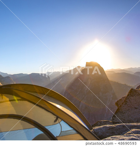 Tent overlooking Half Dome in Yosemite at sunrise Tent overlooking Half Dome in Yosemite at sunrise 48690593