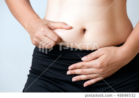 Fat woman hand holding excessive belly fat Fat woman hand holding excessive belly fat 48696532