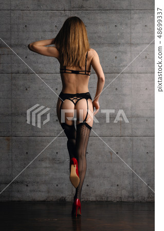 Back view of beautiful woman in black lingerie Back view of beautiful woman in black lingerie 48699337