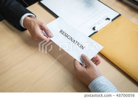 Businessman sending a resignation letter to employer boss in ord 48700856