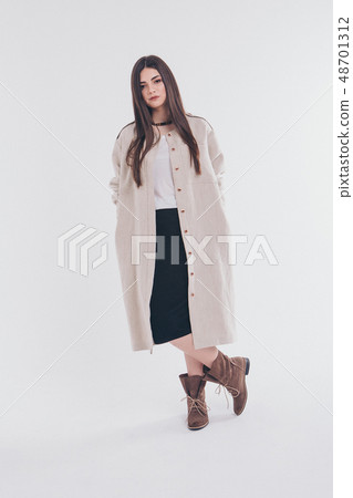 beautiful girl in long linen coat on white beautiful girl in long linen coat on white 48701312