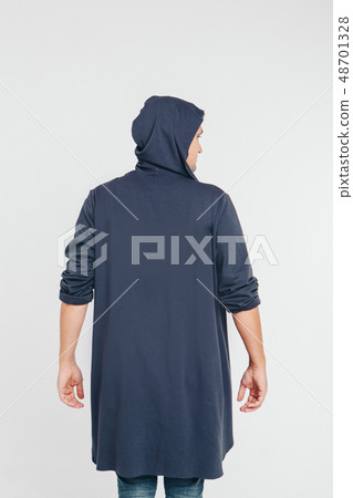 handsome man shows off gray clothes on white handsome man shows off gray clothes on white 48701328