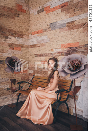 March 8: beautiful girl with long hair next to a March 8: beautiful girl with long hair next to a 48701331