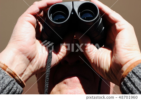 Man looking at his nephew playing soccer. 48701960
