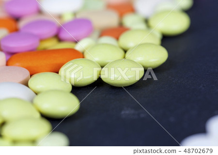 multi-colored tablets and pills 48702679