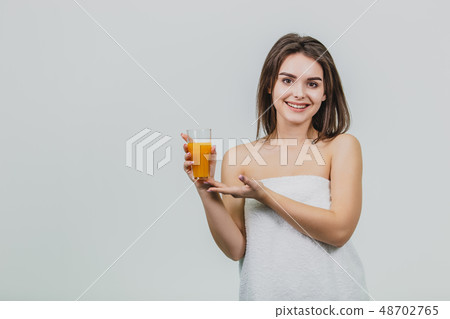 Healthy Lifestyle - A fitness woman with juice, smiling happily looking at the camera. Wonderful 48702765