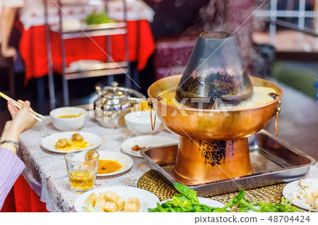 Hot pot on the table Hot pot on the table 48704424