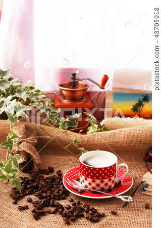 A cup of coffee and coffee beans A cup of coffee and coffee beans 48705918