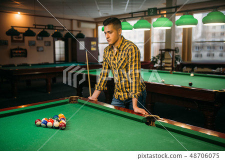Male billiard player, poolroom on background 48706075