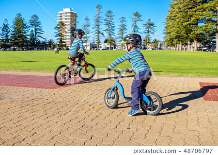 Children riding bicycles in Glenelg 48706797