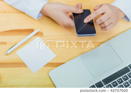 Top view of a shot from the hands of a person with the help of a smartphone in the interior, rear 48707600