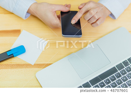 Top view of a shot from the hands of a person with the help of a smartphone in the interior, rear 48707601