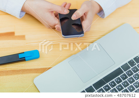 Top view of a shot from the hands of a person with the help of a smartphone in the interior, rear 48707612