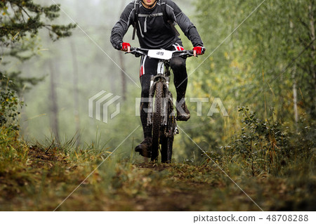 mountain biker on dirty cycle mountain biker on dirty cycle 48708288