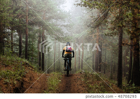 cyclist with backpack riding cyclist with backpack riding 48708293