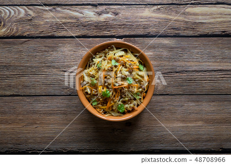 Braised cabbage with carrots and lentils. Braised cabbage with carrots and lentils. 48708966