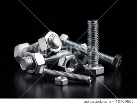 Still life with steel bolts and nuts. Still life with steel bolts and nuts. 48709605