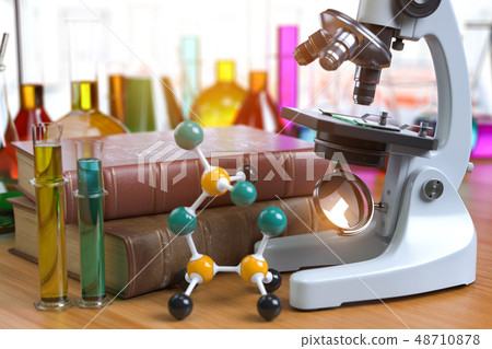 Microscope with alboratory equipmente flasks and 48710878