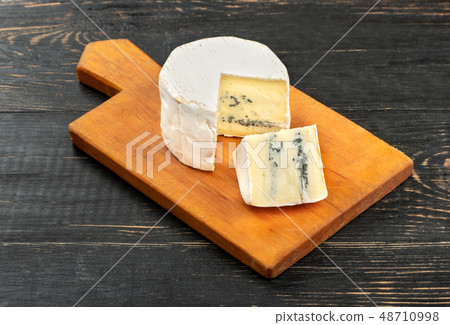 Brie cheese with slice Brie cheese with slice 48710998