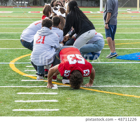 Tug of war on a turf field Tug of war on a turf field 48711226