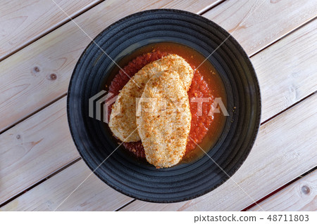 Cutlet in breading with adjika sauce 48711803