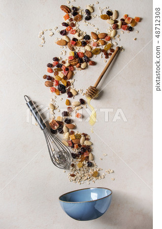 Variety of dried fruits and nuts 48712308