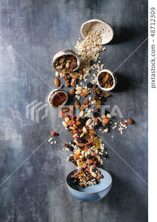 Variety of dried fruits and nuts 48712309