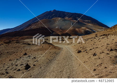 Mars landscape with tracks towards Teide volcano peak Mars landscape with tracks towards Teide volcano peak 48712665