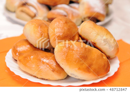 a stack of buns on a white plate a stack of buns on a white plate 48712847