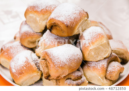 a stack of buns on a white plate a stack of buns on a white plate 48712850