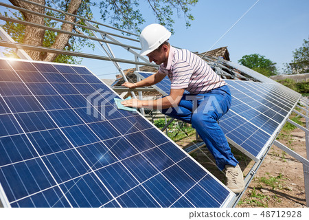 Stand-alone exterior solar panel system installation, renewable green energy generation concept. 48712928