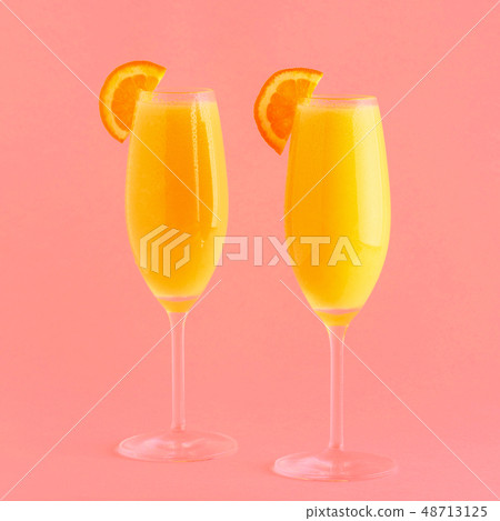 Yellow cocktail on a bright background. 48713125