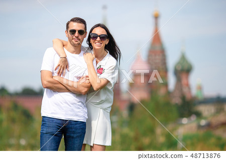 Young dating couple in love walking in city background St Basils Church Young dating couple in love walking in city background St Basils Church 48713876